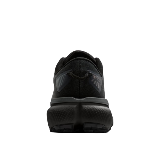 A black athletic shoe shown from the rear, featuring a textured black upper and a thick, chunky black sole, set against a plain white background.