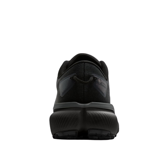 A black athletic shoe shown from the rear, featuring a textured black upper, a black heel pull tab, and a thick black cushioned sole, set against a plain white background.