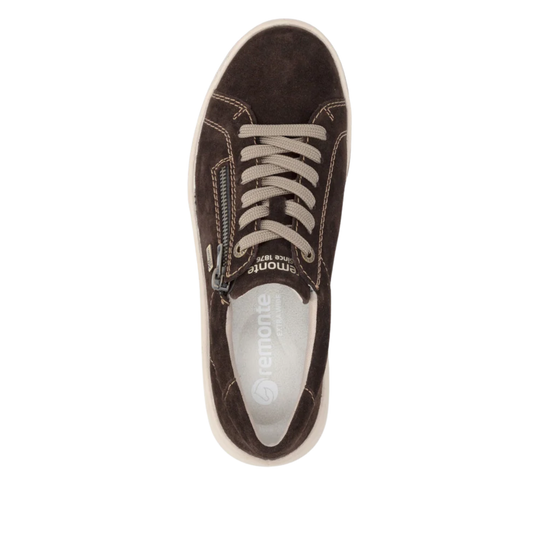 Brown sneaker with white/beige laces on a white background