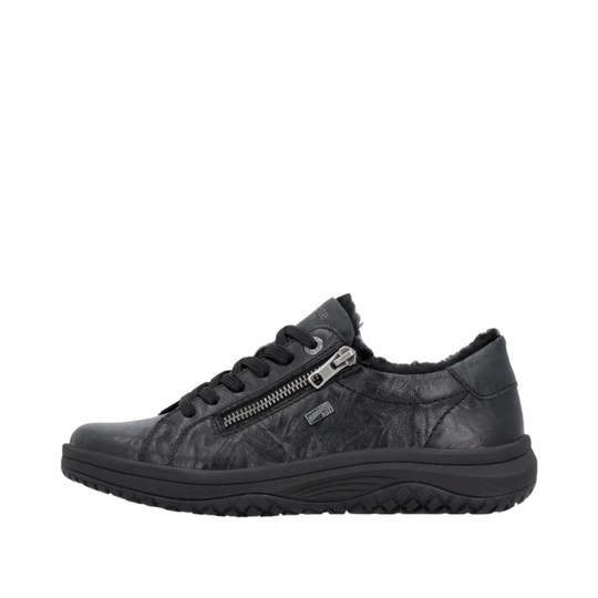 Black sneaker with zipper detail on a white background