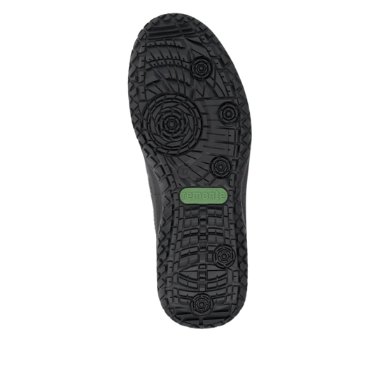 The black textured rubber outsole of a shoe, featuring a green oval brand tag that reads 'remonte' in white, shown against a plain white background.
