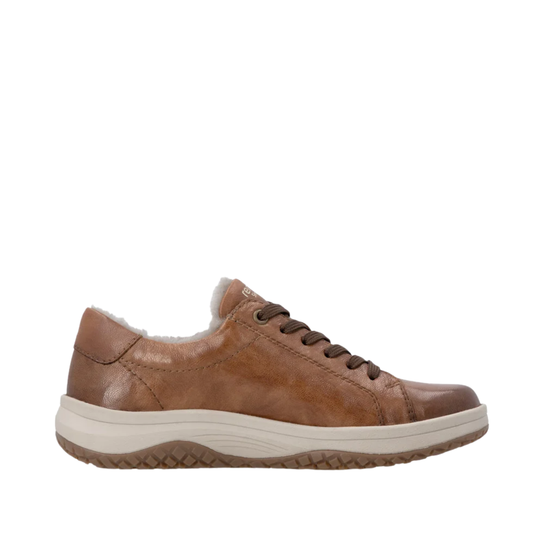 Brown leather shoe on a white background