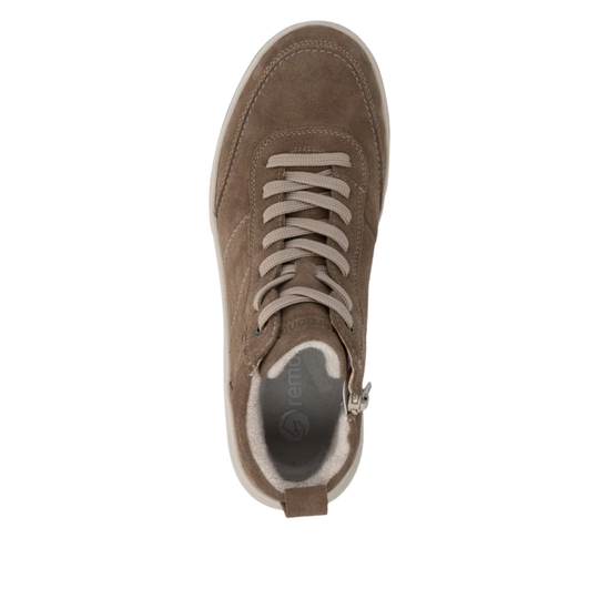 A top-down view of a taupe brown suede sneaker with matching laces, a white sole, and a side zipper, shown on a plain white background.