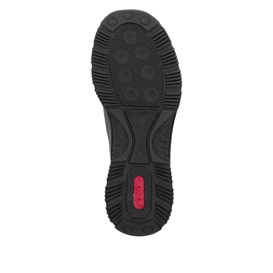 The black rubber outsole of a boot, featuring a textured tread pattern and a red 'Rieker' logo near the heel, shown against a plain white background.