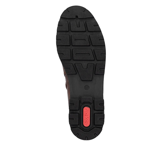 A top-down view of a black rubber shoe sole with a textured tread pattern and a small red heel accent featuring the brand name 'Rieker'.