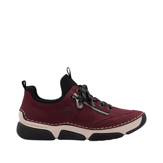 A single burgundy low-top sneaker with black laces, a black collar, and a beige and black sole, shown from a side profile on a white background.