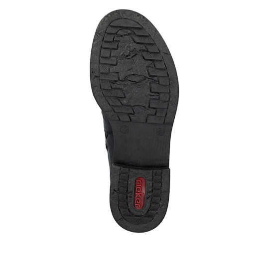 Black rubber sole of a shoe with brand logo on a white background