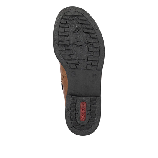 A top-down view of a black rubber shoe sole with a wavy tread pattern and embossed branding, shown on a plain white background.