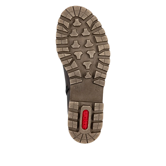 Close-up of a boot sole with a brand logo on a white background