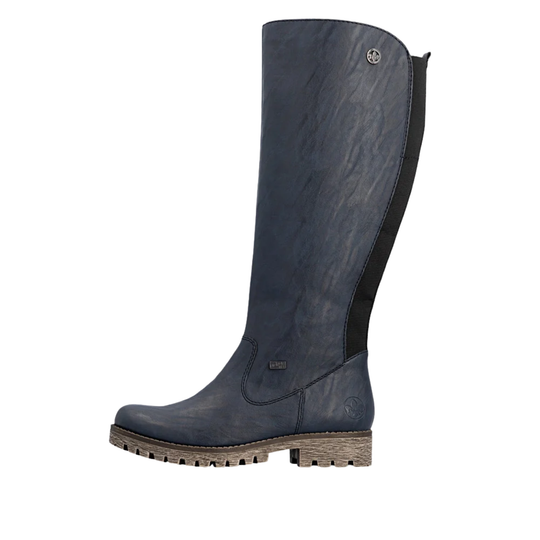 A single tall riding boot in dark navy blue leather with a black side panel and a brown lug sole, shown from a side profile on a white background.