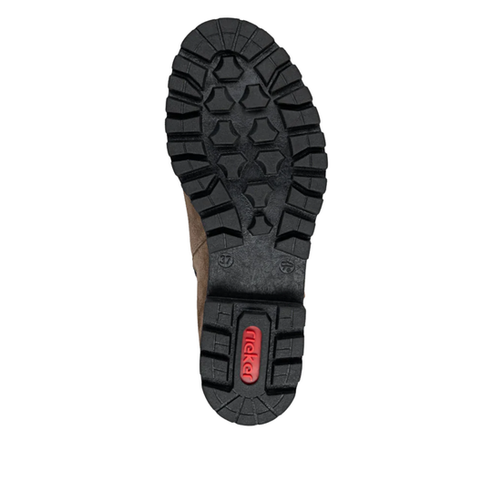 A top-down view of a boot's black treaded sole, showing a textured lug pattern and a small red 'rieker' brand logo on the heel, set against a plain white background.