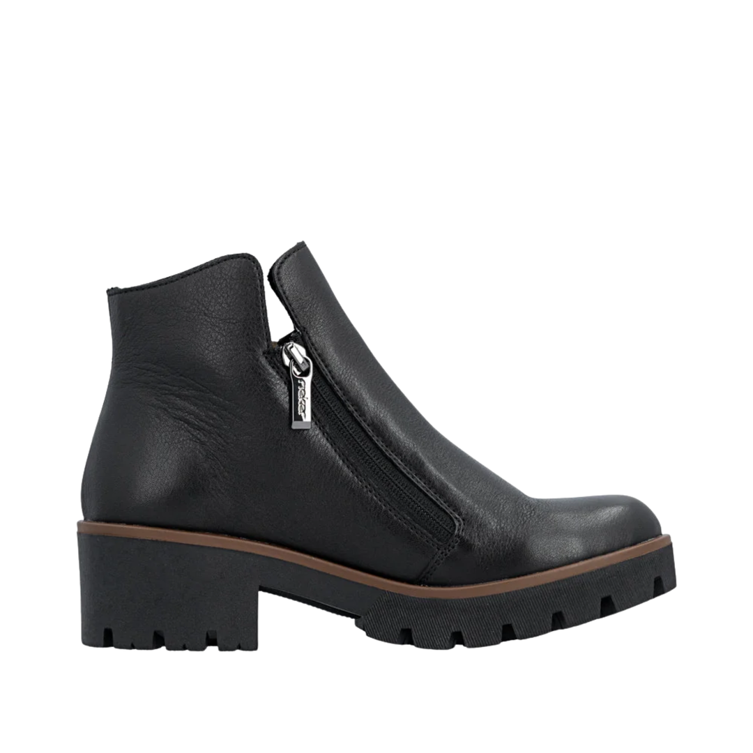 Black ankle boot with a zipper on a white background
