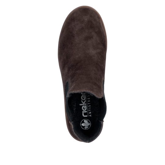 A single dark brown suede ankle boot shown from a top-down view on a solid white background. The brand name 'Rieker' is visible on the black inner lining.