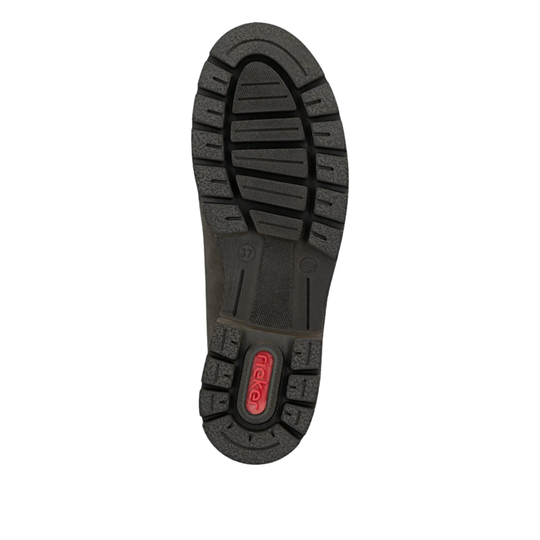 The black rubber outsole of a boot, showing the tread pattern and a red 'NexGen' logo badge near the heel, isolated on a white background.