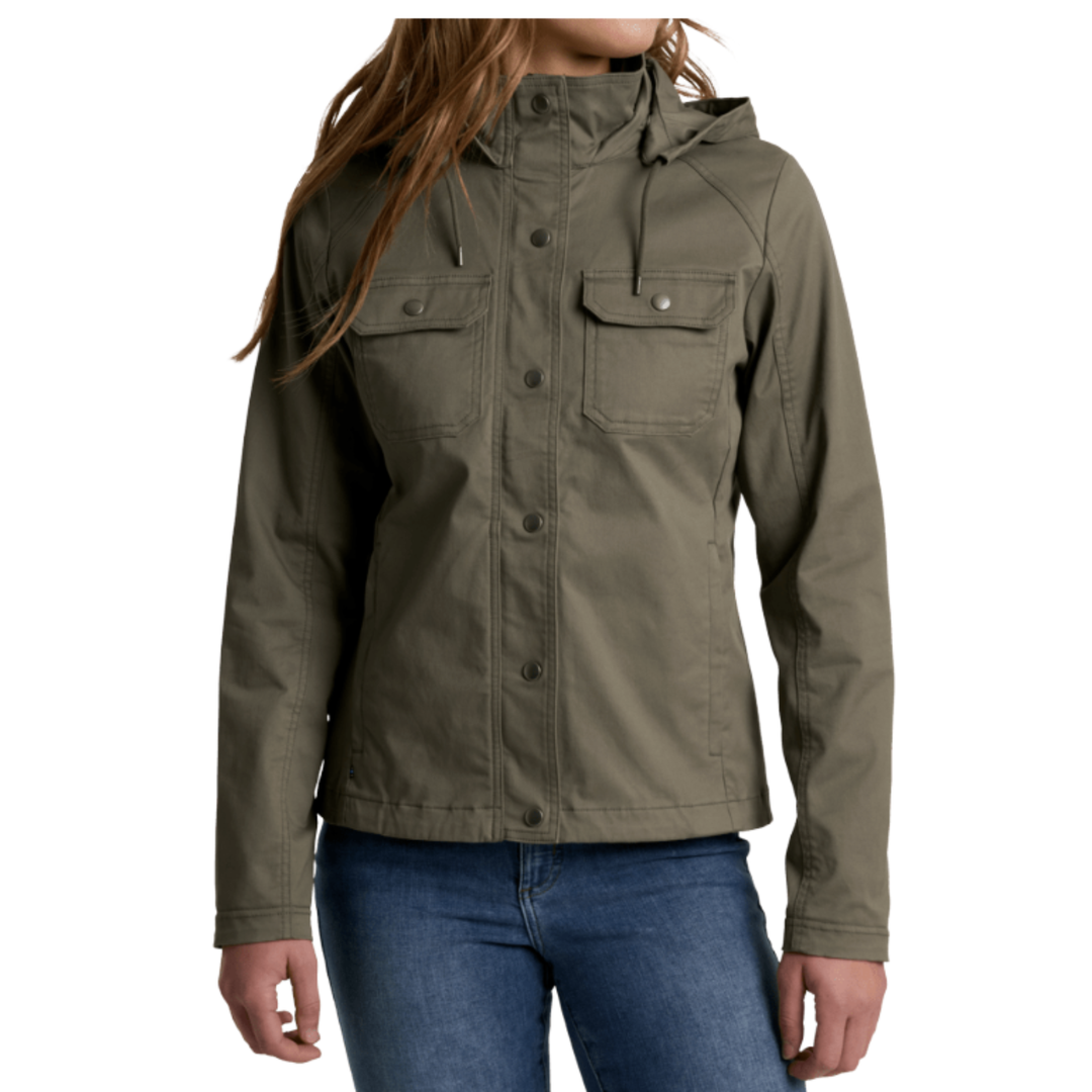 A woman wearing an gun metal hooded utility jacket with flap chest pockets and snap buttons, paired with blue jeans, shown against a plain white background.
