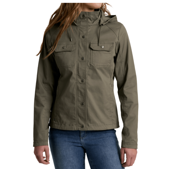A woman wearing an gun metal hooded utility jacket with flap chest pockets and snap buttons, paired with blue jeans, shown against a plain white background.