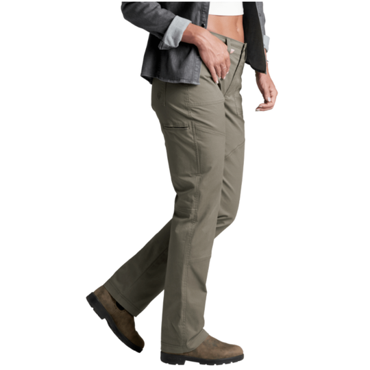 A person wearing olive green cargo pants, styled with a gray denim jacket, white crop top, and brown boots, shown from the waist down against a plain white background.