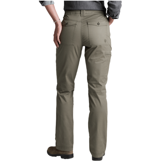 Rear view of a person wearing olive green outdoor pants with a gray shirt and brown boots, shown against a plain white background.