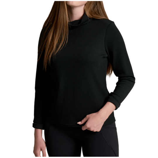 A woman wearing a black long-sleeve mock neck top and black leggings, shown from the neck down against a plain white background.