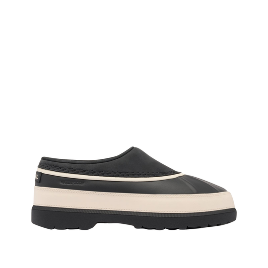 A slip-on clog-style shoe in black with a thick cream-colored midsole stripe and a black outsole, shown from a side profile view against a plain white background.