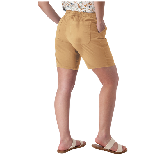 A person shown from the back wearing tan shorts with side pockets, a patterned top, and beige slide sandals against a plain white studio background.