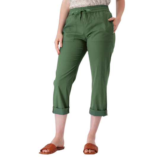 A model wearing olive green cropped pants with a drawstring waist and rolled cuffs, paired with brown slide sandals against a plain white background.