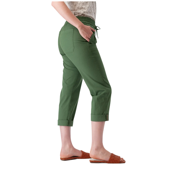 A person shown from the waist down wearing olive green cropped pants with a drawstring waistband, side pockets, and rolled cuffs, paired with brown slide sandals against a plain white background.