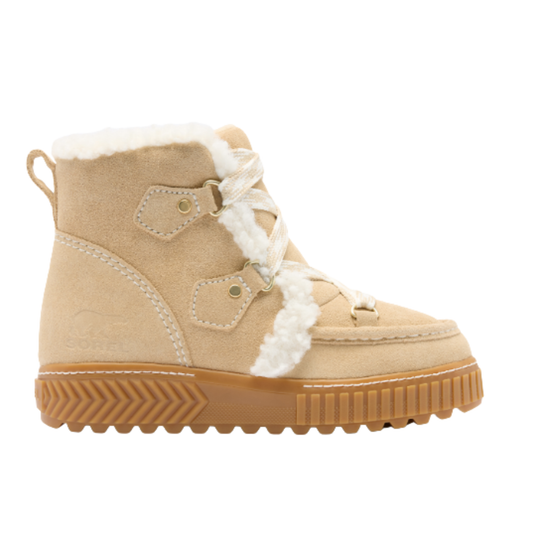 A women's beige suede winter boot with white faux-fur trim, decorative laces, and a brown textured sole, shown against a plain white background.