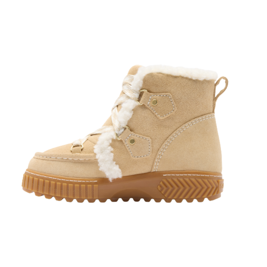 A beige suede winter boot with white faux-fur trim, white laces, and a brown textured sole, shown from a side profile on a white background.