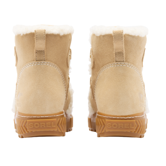 A pair of beige suede ankle boots with white shearling lining and brown Sorel soles, shown from the back on a white background.