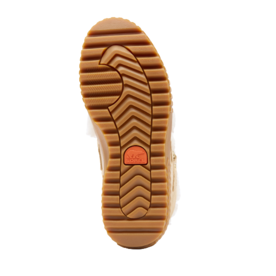 A close-up top-down view of a brown rubber shoe sole with deep tread grooves and a small orange brand patch in the center, shown on a white background.