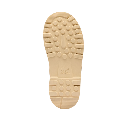 The beige outsole of a boot, showing the tread pattern and a molded logo in the center, isolated on a white background.