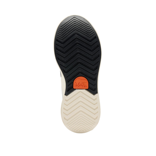The outsole of a shoe shown from a top-down view, featuring a black chevron-patterned tread, an orange circular SOREL logo, and a cream-colored flexible midsole.