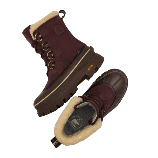 A pair of Sorel lace-up winter boots in burgundy with a cream shearling lining, shown from multiple angles on a white background.