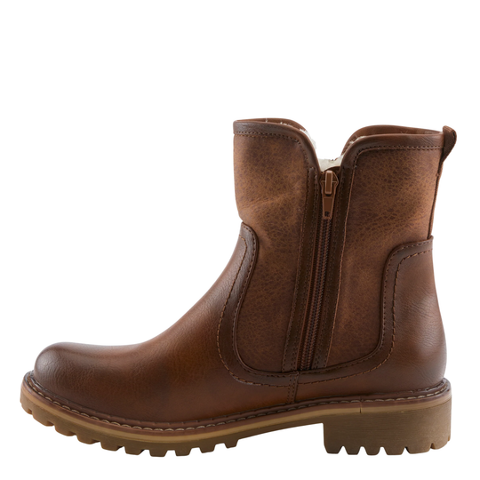 A brown leather ankle boot with a side zipper, elastic side gore, and a chunky lug sole, shown from a side profile on a white background.