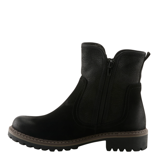A black leather ankle boot with a side zipper, elastic side gore, and a chunky lug sole, shown from a side profile on a white background.