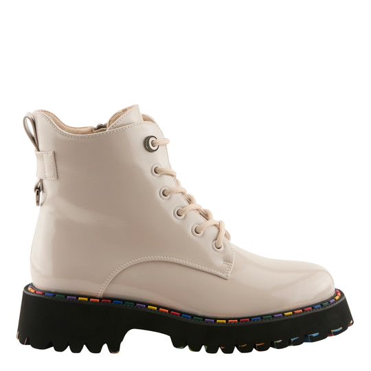 A glossy off-white patent leather lace-up ankle boot with a chunky black lug sole featuring a colorful rainbow stripe detail along the edge, shown against a plain white background.
