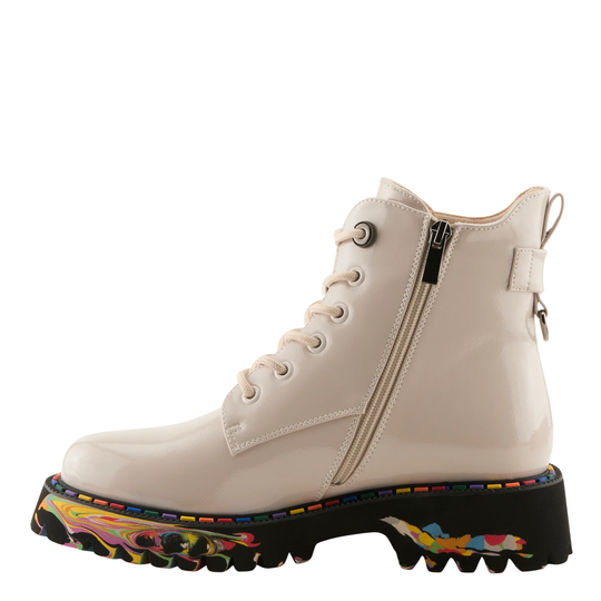 A glossy off-white lace-up ankle boot with a side zipper, a thick black lug sole, and a colorful abstract paint-splatter pattern around the edge of the sole, shown against a plain white background.