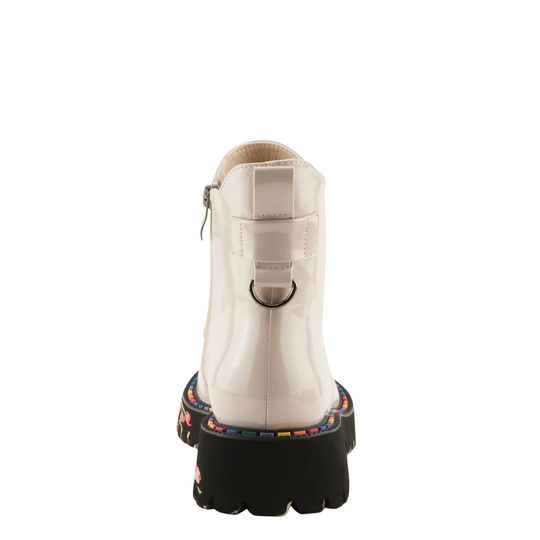 A glossy off-white ankle boot shown from the back, featuring a black lug sole with colorful decorative lettering and a silver-tone metal ring detail.