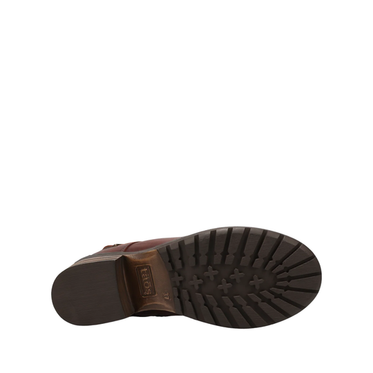 A close-up, top-down view of a brown leather boot's sole, showing the treaded black rubber outsole and a brown heel block with the brand name 'Brixton' embossed on it, set against a plain white background.