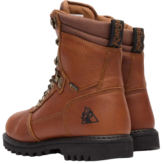A pair of brown leather work boots with black soles, shown from a three-quarter angle against a white background. The boots feature a black triangular logo on the side, a 'GORE-TEX' label near the laces, and 'Range' branding on the heel pull tabs.