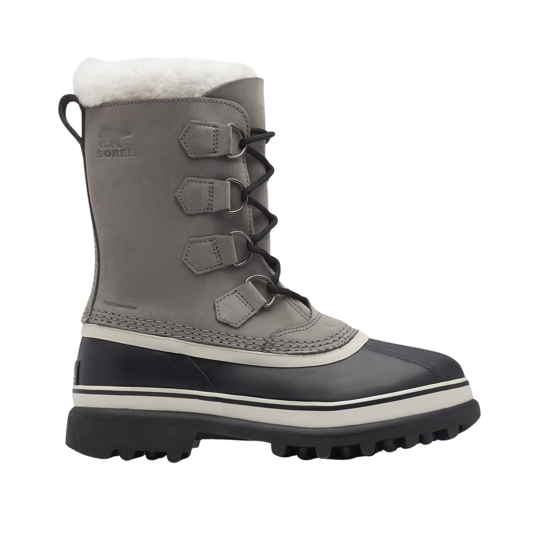 A gray and black winter boot with a white faux-fur collar, featuring three lace-up straps with metal buckles on the side and a thick black lug sole.