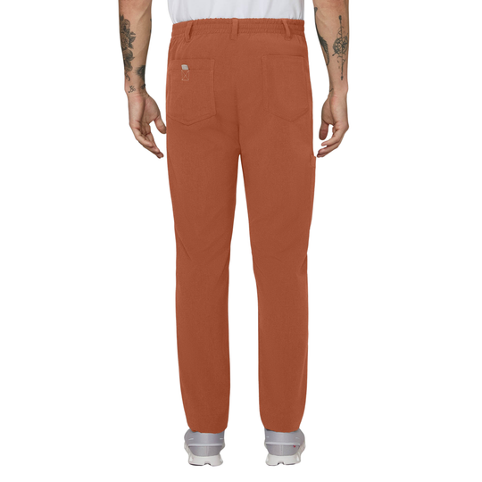 Rust-colored scrub pants shown from the back on a model, featuring a straight-leg fit, belt loops, and two back pockets.