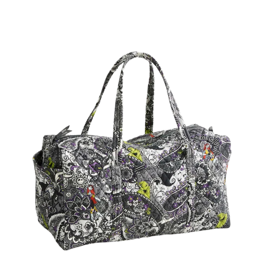 A duffel bag with a complex paisley and floral pattern in black, white, gray, and small accents of green, red, and purple, featuring dual top handles, shown on a plain white background.
