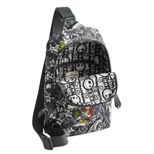 A sling backpack featuring a black and white Jack Skellington pattern with small colorful character accents, shown on a plain white background.