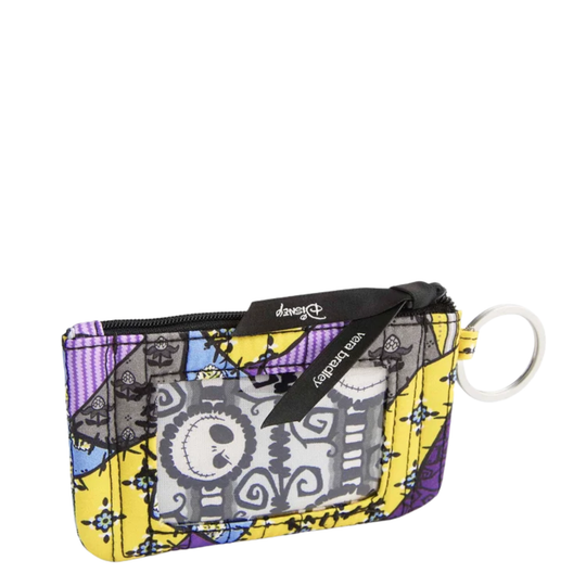 A small zippered card holder or coin purse featuring a colorful 'The Nightmare Before Christmas' pattern with Jack Skellington, a black zipper tab, and a white key ring.