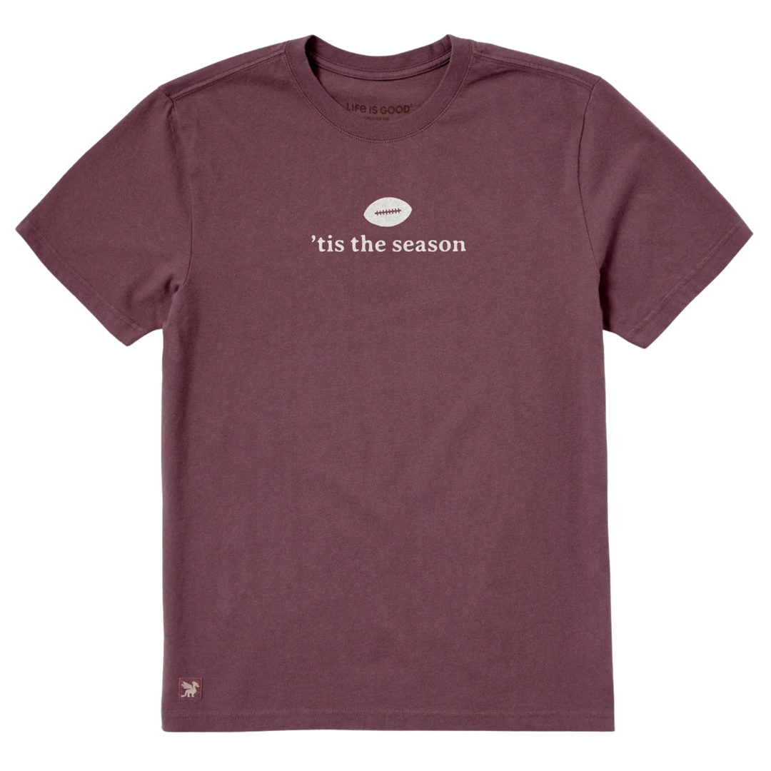 A short-sleeve crewneck t-shirt in heathered dusty mauve with a white graphic on the chest. The graphic features a small white football with the word 'amateur' inside, above the text ''tis the season' in white.