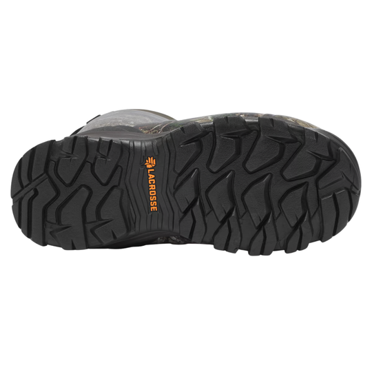 A close-up view of a black athletic boot's outsole, showing a deep tread pattern and the Lacrosse brand name printed in orange on the center.