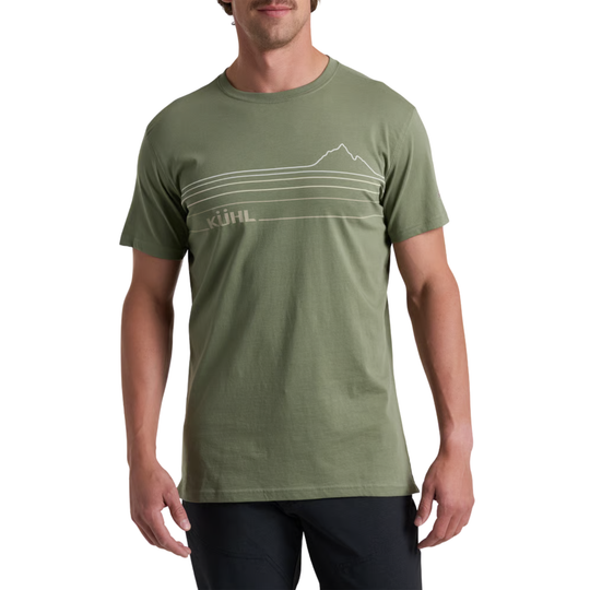 A man wearing a muted olive green short-sleeve t-shirt with a white minimalist mountain line graphic and the KJHL logo printed on the chest, set against a plain white background.