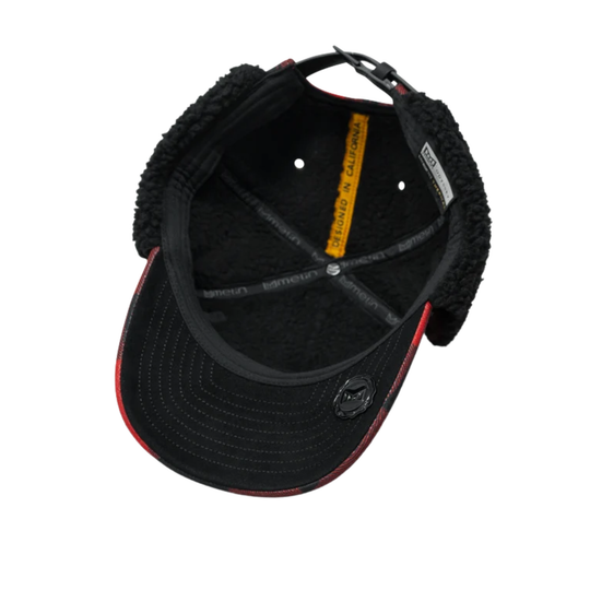 Inside o hat with black fleece lining on a plain white background
